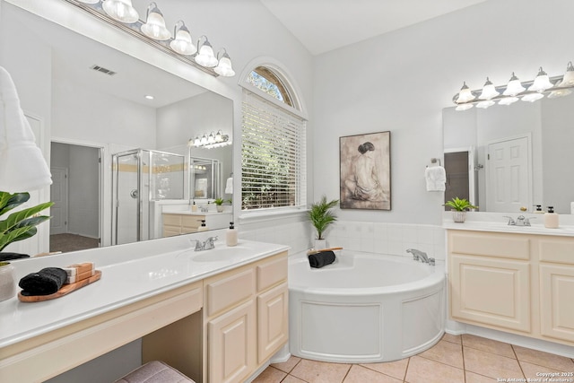 bathroom featuring tile patterned flooring, vanity, and independent shower and bath