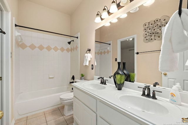 full bathroom with toilet, vanity, tile patterned floors, and shower / washtub combination