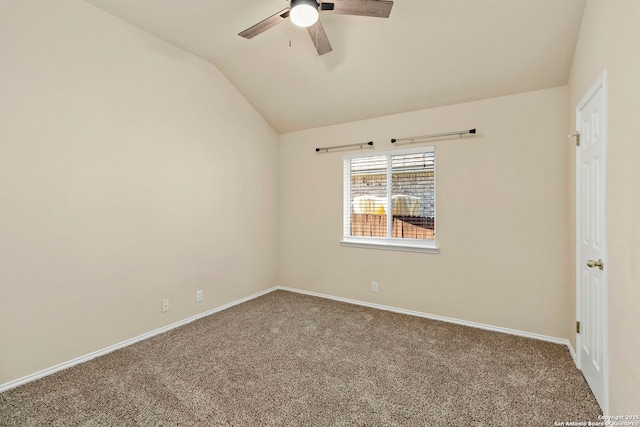 carpeted empty room with ceiling fan and lofted ceiling