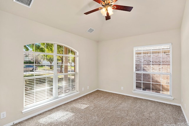 spare room featuring ceiling fan and carpet floors