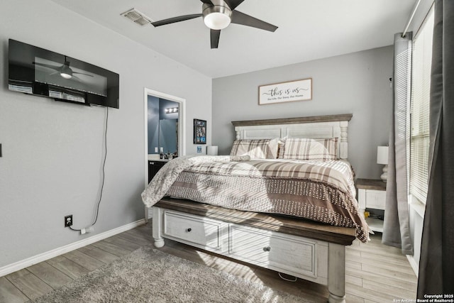 bedroom with ensuite bathroom and ceiling fan