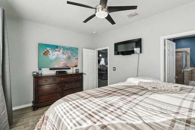 bedroom with ceiling fan, light hardwood / wood-style floors, and connected bathroom