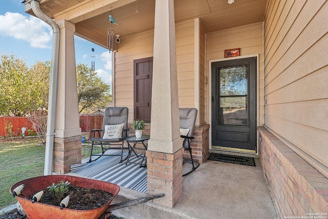 view of exterior entry with covered porch