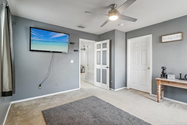 carpeted bedroom with ceiling fan