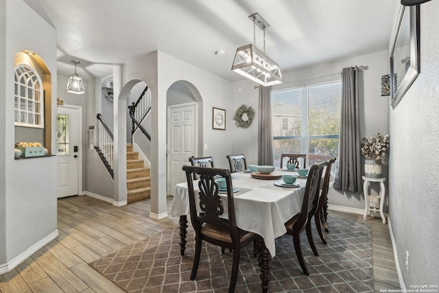 dining area with an inviting chandelier