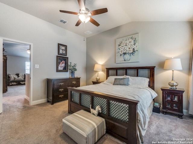 carpeted bedroom featuring vaulted ceiling and ceiling fan