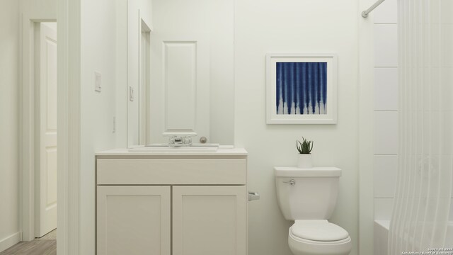 bathroom featuring vanity and toilet