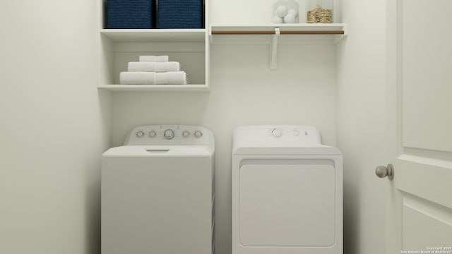 laundry room with separate washer and dryer