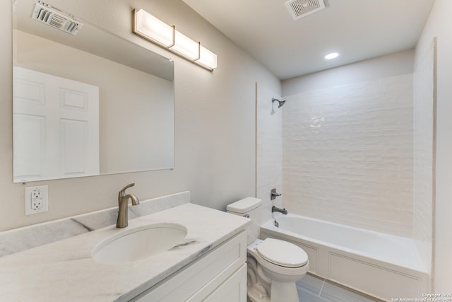 full bathroom with tiled shower / bath combo, toilet, and vanity