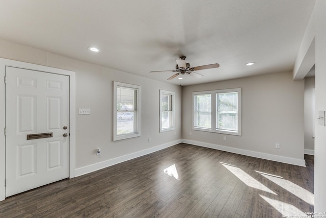 foyer with ceiling fan and dark wood-type flooring