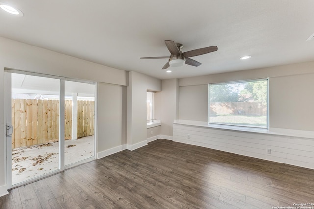 empty room featuring ceiling fan and dark hardwood / wood-style floors