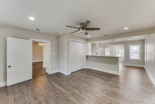 spare room with ceiling fan and hardwood / wood-style floors