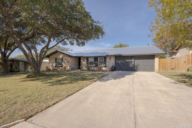 single story home featuring a front yard and a garage