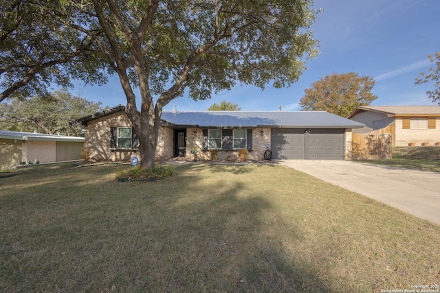 ranch-style house with a garage and a front lawn