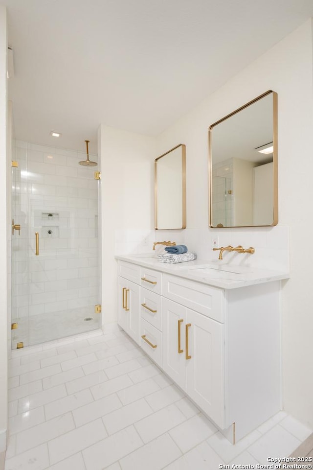 bathroom with tile patterned floors, a shower with door, and vanity