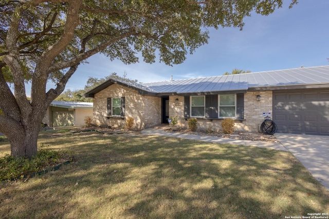 single story home with a garage and a front lawn