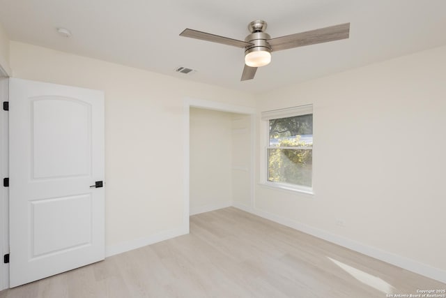 unfurnished room with ceiling fan and light hardwood / wood-style floors