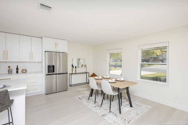 dining room featuring light hardwood / wood-style flooring