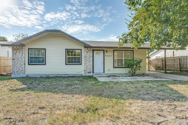 ranch-style house with a front lawn