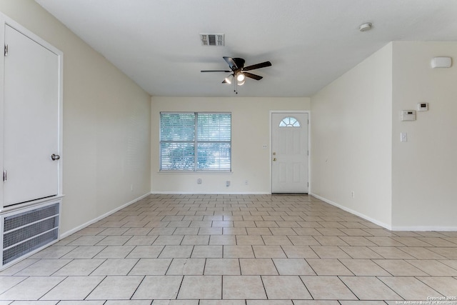 tiled foyer entrance featuring ceiling fan