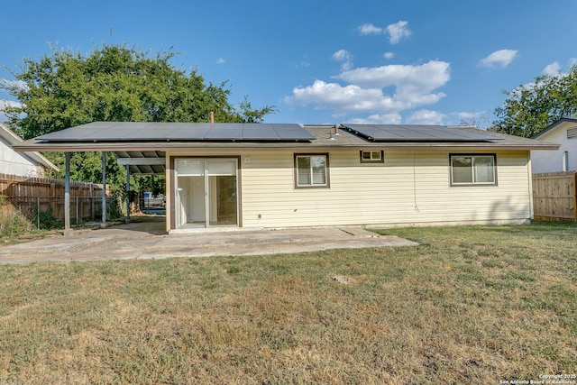 rear view of property with a patio area and a lawn