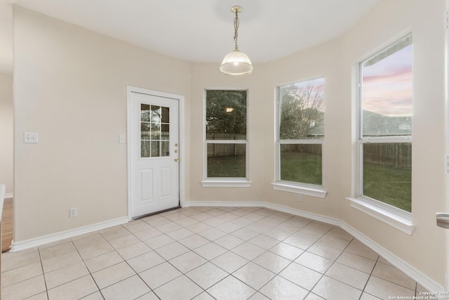 unfurnished dining area with light tile patterned floors