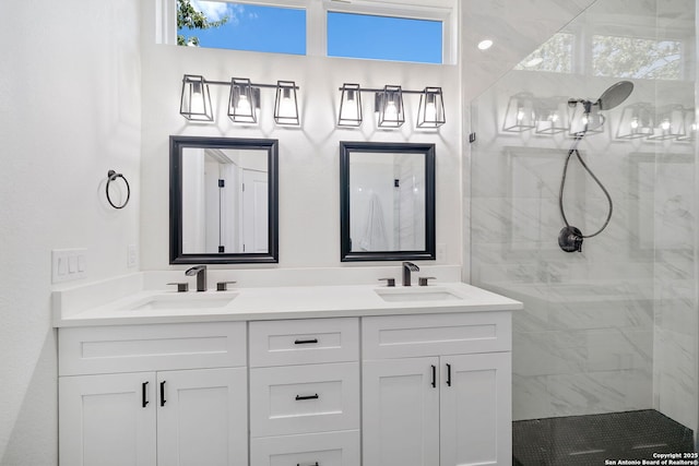 bathroom featuring vanity and tiled shower