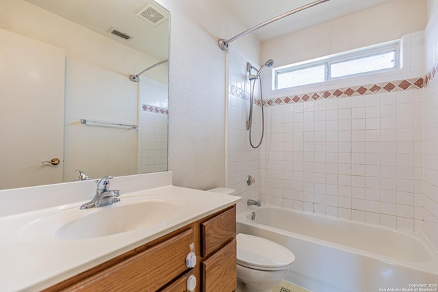 full bathroom with vanity,  shower combination, and toilet