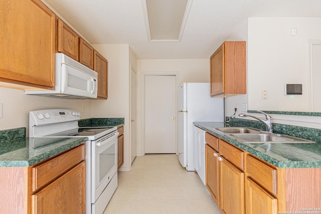 kitchen with sink and white appliances