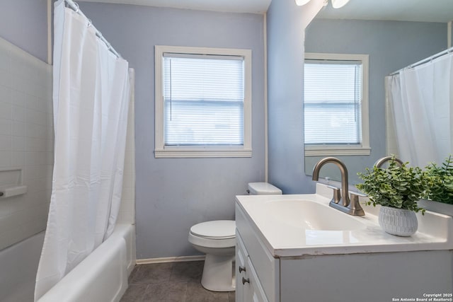 full bathroom featuring toilet, vanity, tile patterned floors, and shower / bath combo with shower curtain