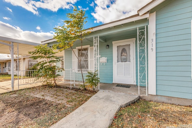 entrance to property with covered porch