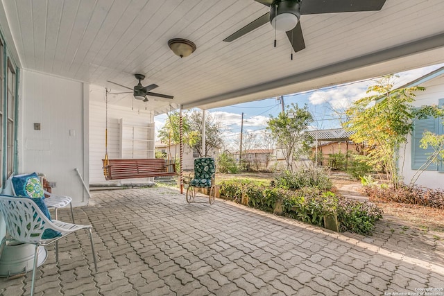 view of patio featuring ceiling fan