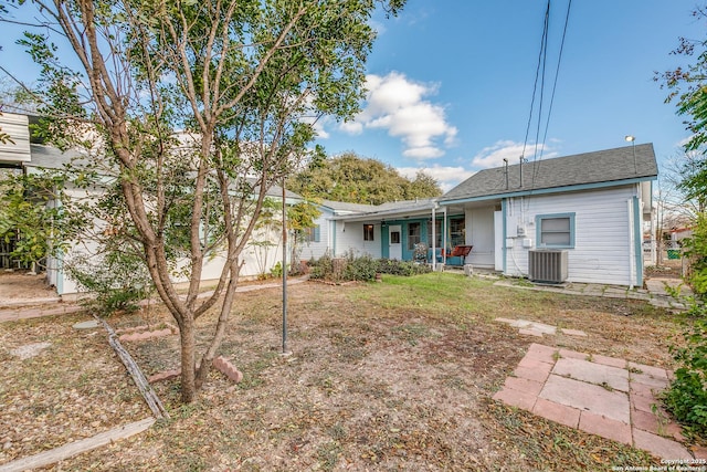 rear view of house with central AC