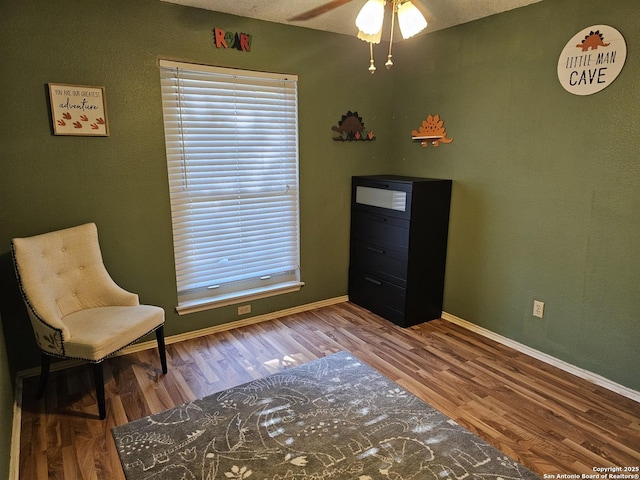 unfurnished room with hardwood / wood-style flooring and ceiling fan