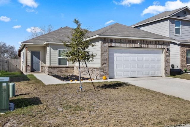 view of front of property with a front lawn and a garage