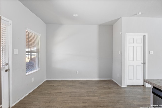 unfurnished room featuring dark hardwood / wood-style flooring