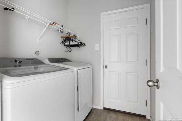 washroom featuring independent washer and dryer and dark hardwood / wood-style flooring