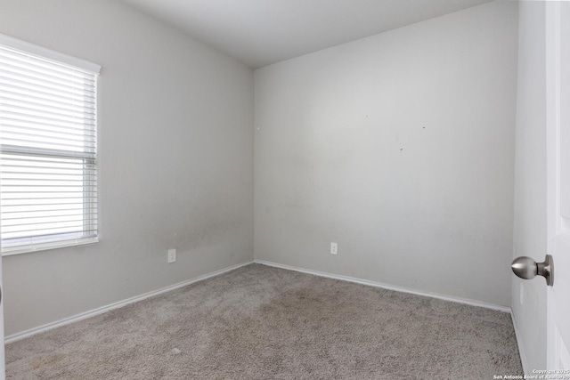 carpeted empty room featuring plenty of natural light