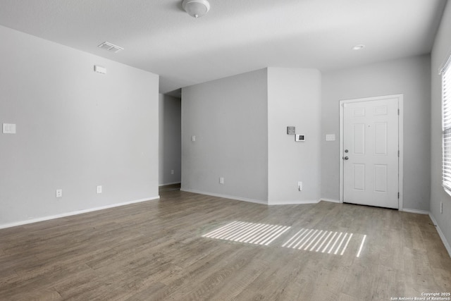 unfurnished living room featuring light hardwood / wood-style flooring