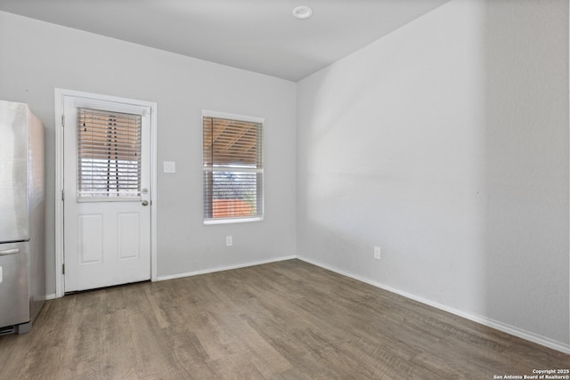 empty room featuring hardwood / wood-style floors