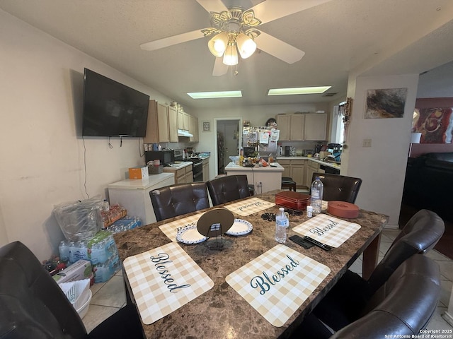 tiled dining space with ceiling fan