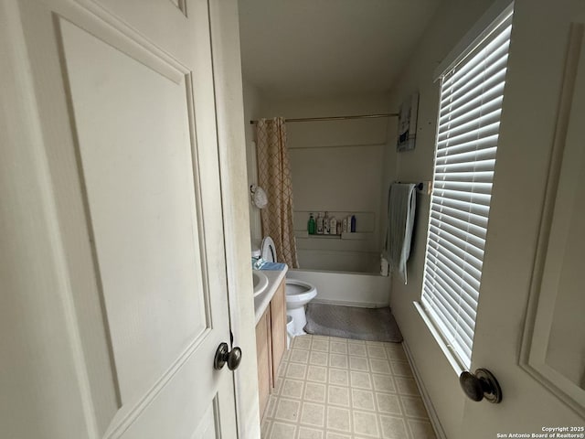 full bathroom featuring vanity, toilet, and shower / bath combo with shower curtain