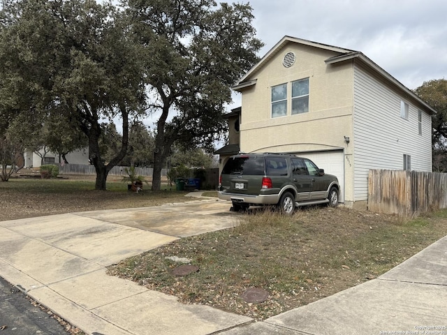 view of property exterior featuring a garage