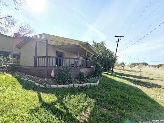 rear view of property with a lawn