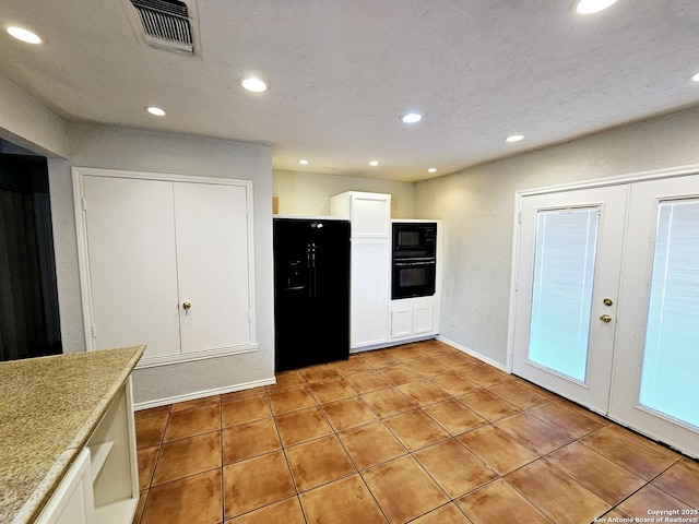 kitchen with white cabinetry, french doors, light tile patterned flooring, and black appliances