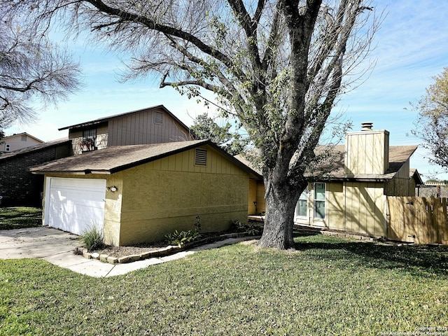 view of property exterior with a lawn and a garage