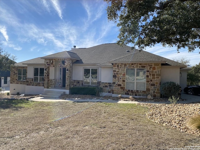 ranch-style home featuring a front yard