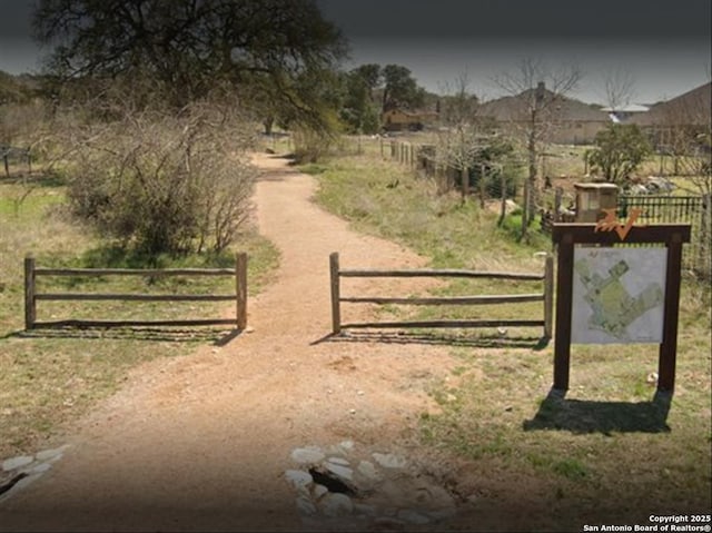 view of gate featuring a rural view