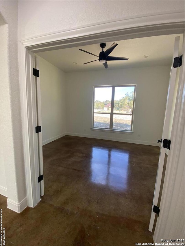 spare room with ceiling fan