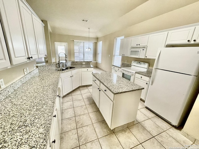 kitchen featuring white appliances, white cabinets, sink, hanging light fixtures, and light stone countertops